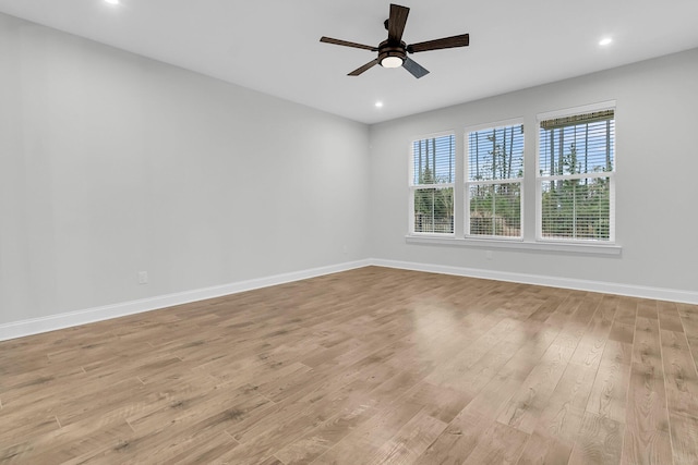 unfurnished room with ceiling fan and light hardwood / wood-style floors