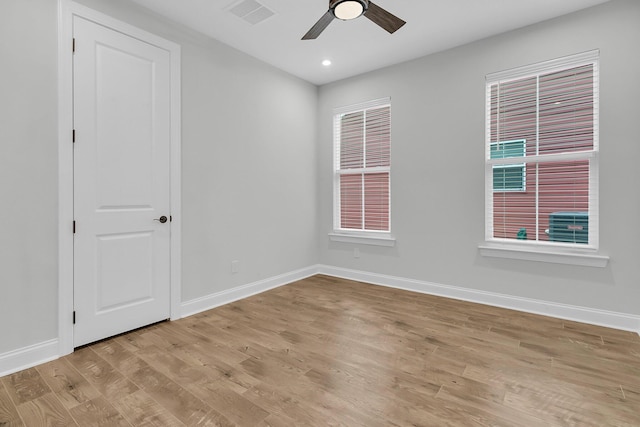 spare room with ceiling fan and light hardwood / wood-style flooring