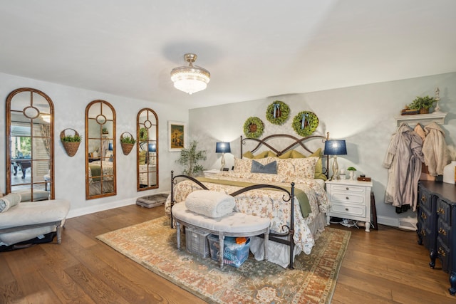 630 Cain Dr, Mount Pleasant, SC 29464 - bedroom featuring wood finished floors, a chandelier, and baseboards