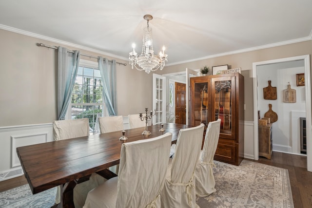 630 Cain Dr, Mount Pleasant, SC 29464 - dining room featuring a chandelier, crown molding, wood finished floors, french doors, and a wainscoted wall