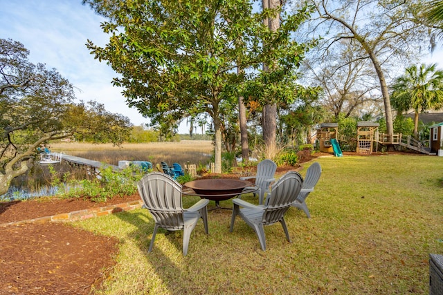 630 Cain Dr, Mount Pleasant, SC 29464 - view of grassy yard featuring a fire pit and a playground