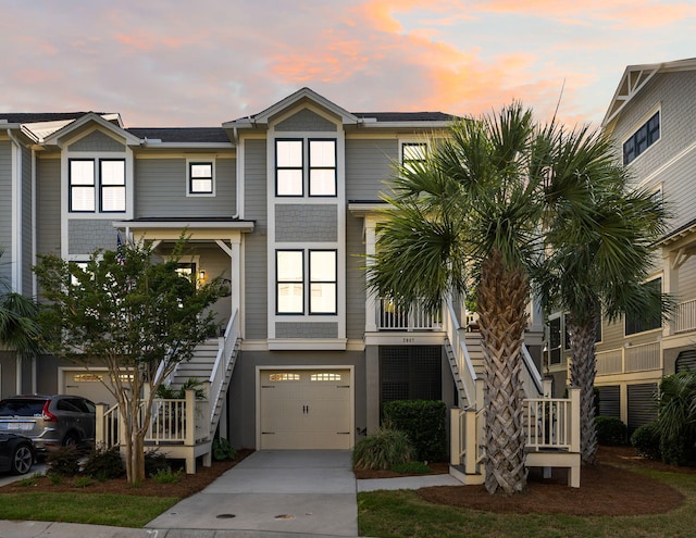 2087 Sterling Marsh Ln, Seabrook Island, SC 29455 - view of front of house featuring stairway, a garage, and driveway