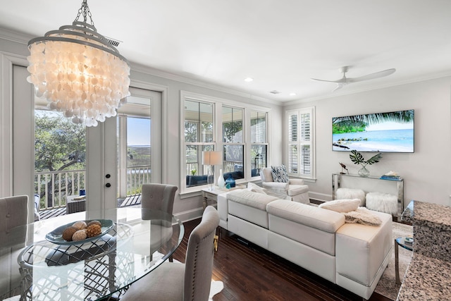 2087 Sterling Marsh Ln, Seabrook Island, SC 29455 - living area featuring dark wood-type flooring, crown molding, a chandelier, baseboards, and a ceiling fan