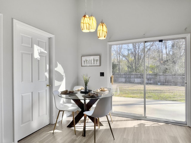 dining area featuring light wood-type flooring