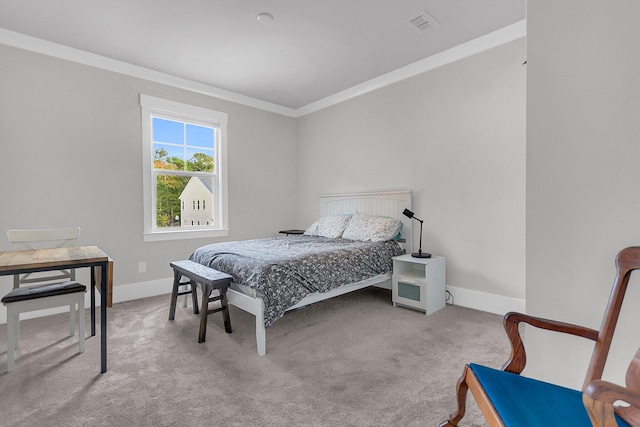 bedroom featuring light colored carpet and ornamental molding