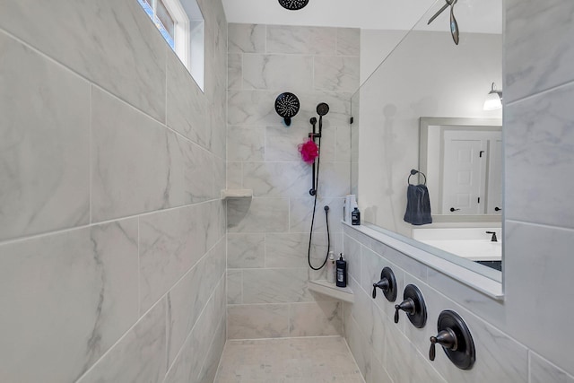 bathroom with tiled shower