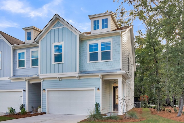 view of front of property with central AC and a garage