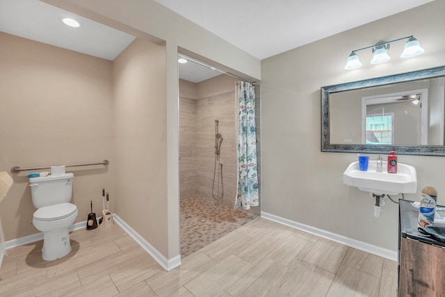 bathroom featuring tile patterned floors, sink, a shower with curtain, and toilet