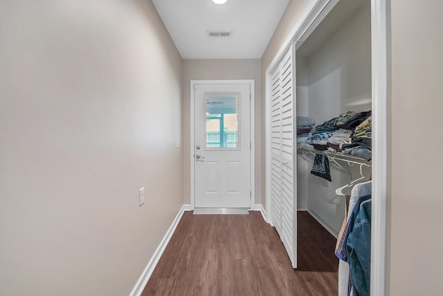 doorway to outside with dark hardwood / wood-style flooring