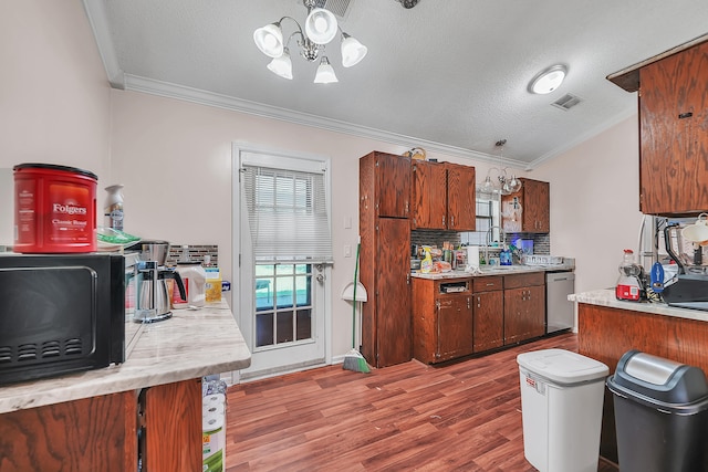 kitchen featuring ornamental molding, stainless steel dishwasher, a textured ceiling, and dark hardwood / wood-style floors