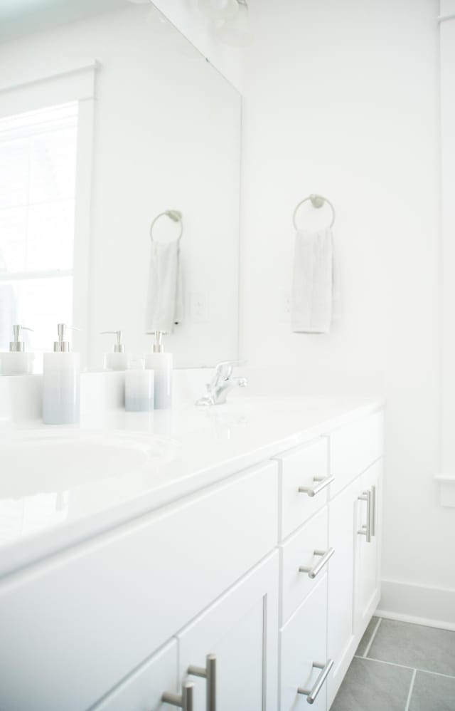 bathroom with vanity and tile patterned floors