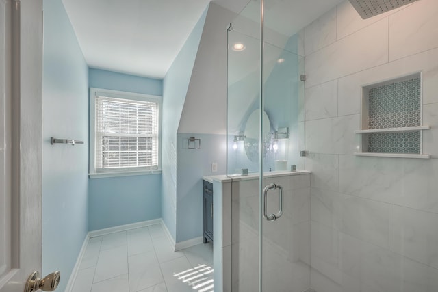 bathroom with a shower with shower door and tile patterned floors