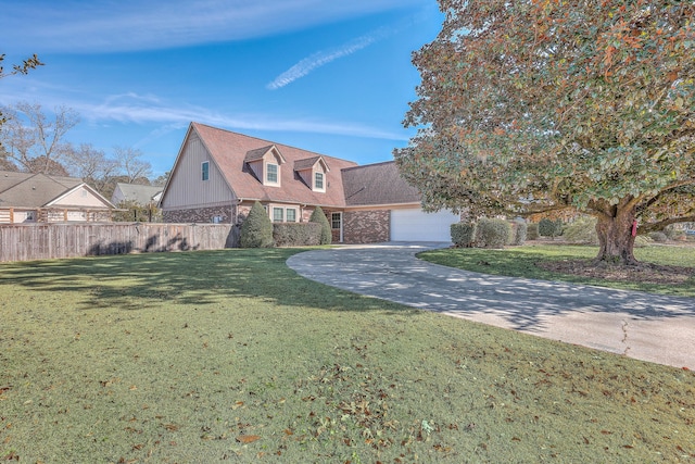 view of front facade with a garage and a front lawn