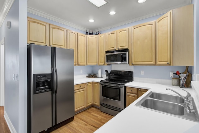 kitchen featuring ornamental molding, appliances with stainless steel finishes, sink, and light brown cabinets