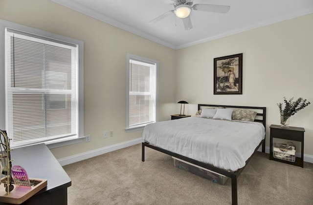 bedroom featuring crown molding, carpet flooring, and ceiling fan