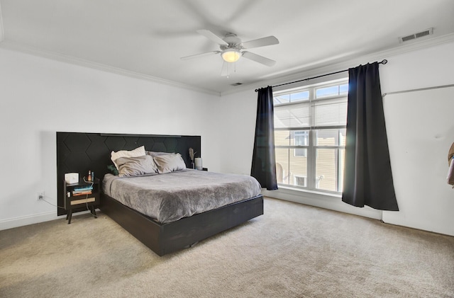 bedroom featuring multiple windows, ornamental molding, and ceiling fan