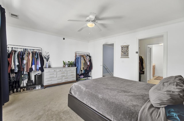 carpeted bedroom with ceiling fan, ornamental molding, and connected bathroom