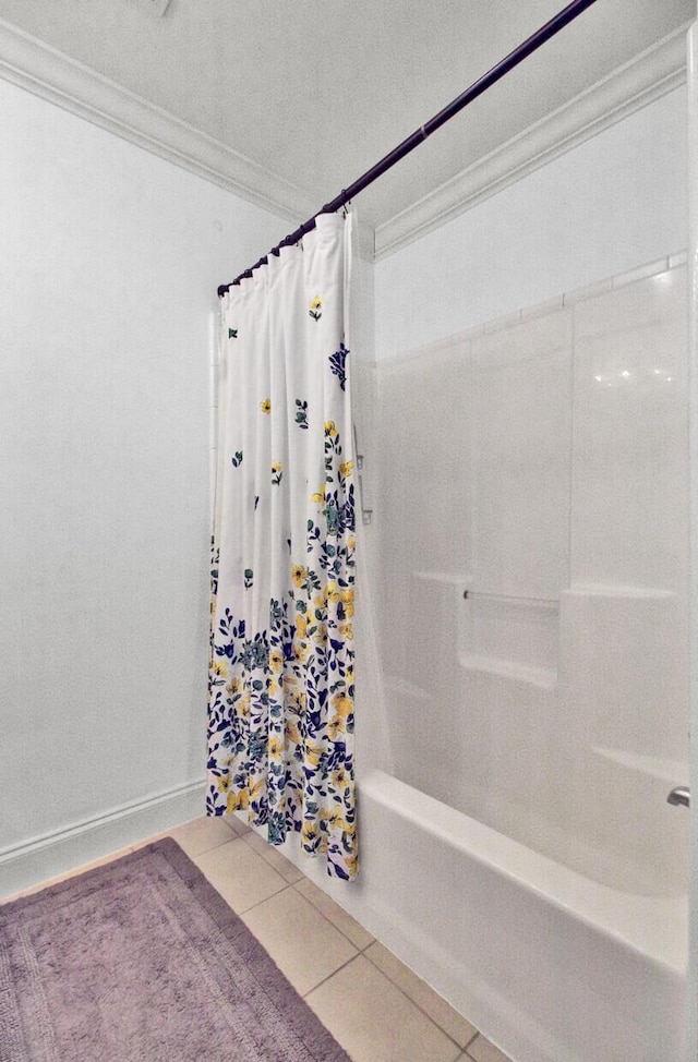 bathroom featuring ornamental molding, tile patterned floors, and shower / bathtub combination with curtain