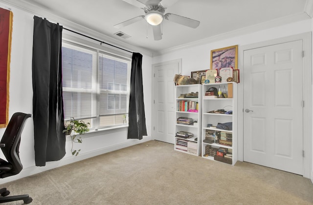 office area with ceiling fan, light colored carpet, and ornamental molding