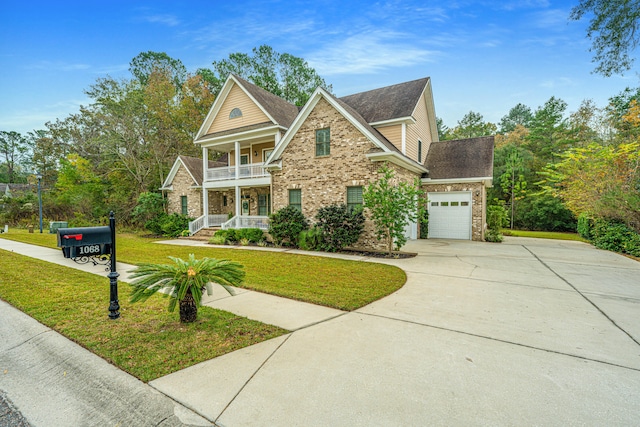 view of front of property with a front yard, a porch, a balcony, and a garage