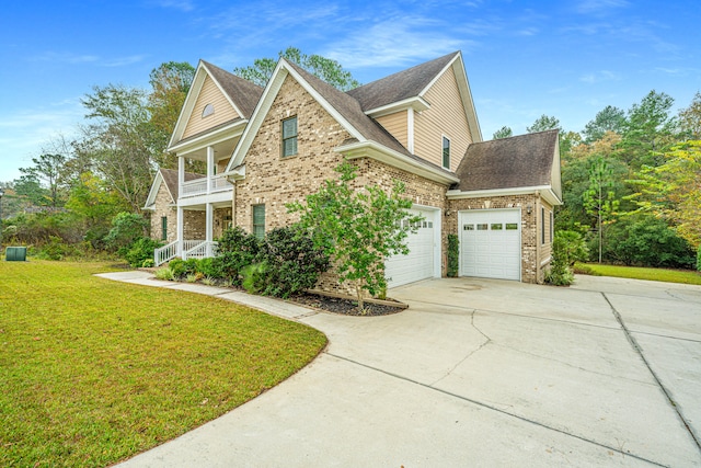 front facade with a front yard, a balcony, and a garage