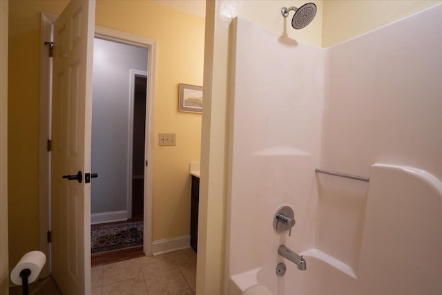 bathroom featuring vanity, bathing tub / shower combination, and tile patterned flooring