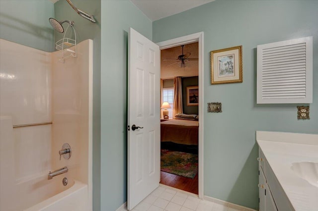 bathroom with vanity, tub / shower combination, and tile patterned floors