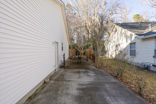 view of side of property with a patio area