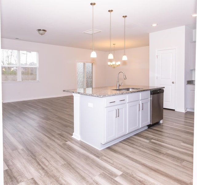 kitchen with white cabinetry, sink, hanging light fixtures, a kitchen island with sink, and stainless steel dishwasher