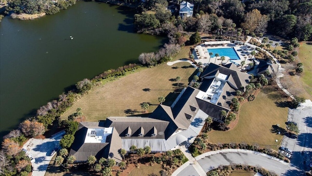 aerial view of property's location with a large body of water and a pool area