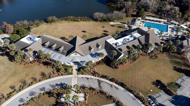 aerial view of property and surrounding area with a pool area