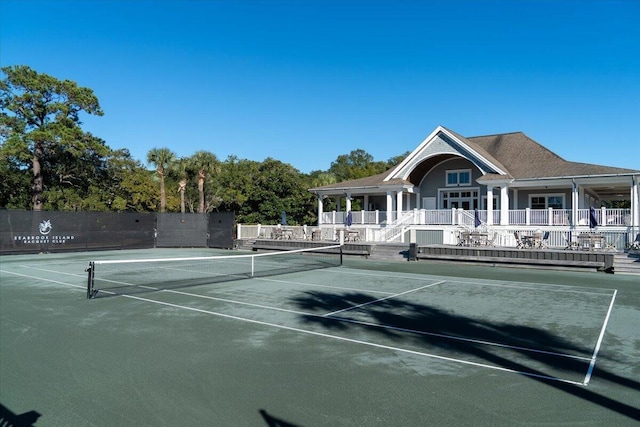 view of tennis court with fence