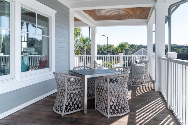 deck featuring outdoor dining area