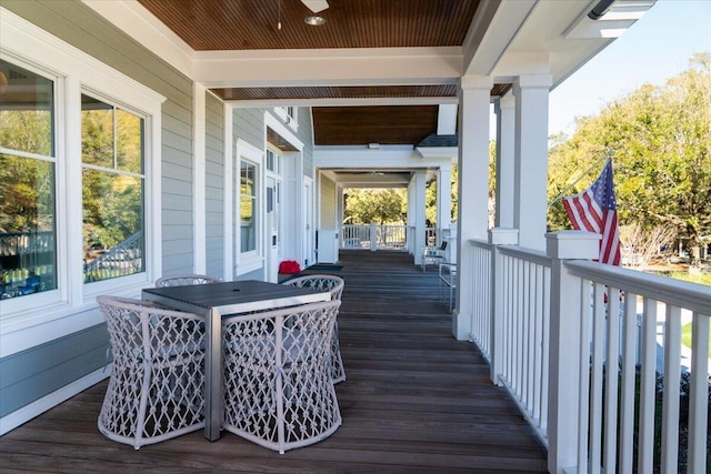 wooden terrace with a porch