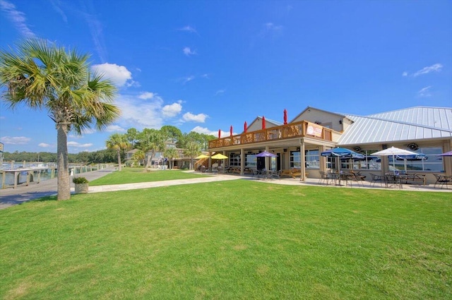 view of home's community with a yard