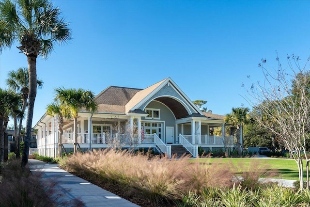 view of front of property featuring a porch and stairway