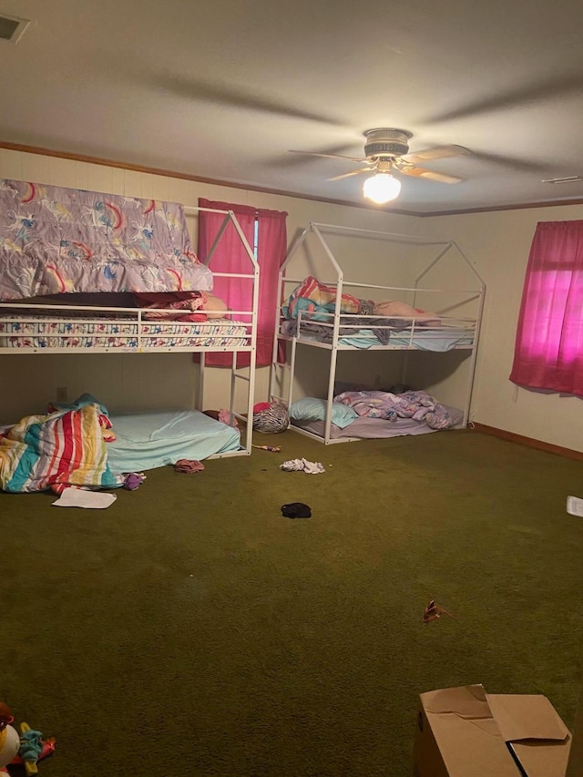 unfurnished bedroom featuring ceiling fan and carpet flooring