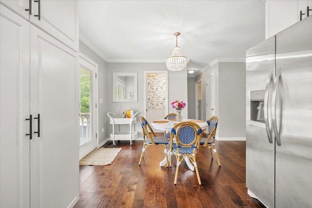 dining room featuring baseboards, crown molding, a chandelier, and dark wood finished floors