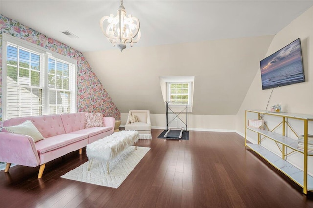 living area with a chandelier, plenty of natural light, baseboards, wood-type flooring, and lofted ceiling