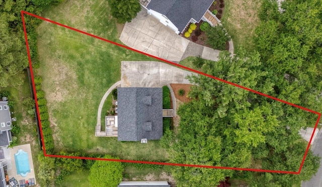 aerial view of property and surrounding area with property parcel outlined