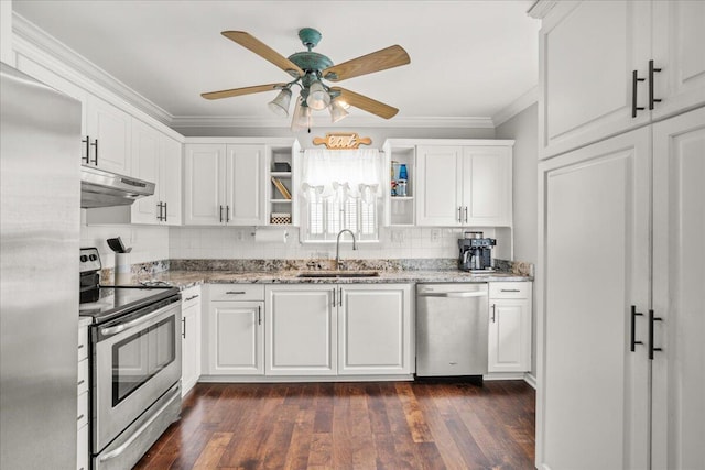 kitchen featuring stainless steel appliances, a sink, under cabinet range hood, ornamental molding, and open shelves