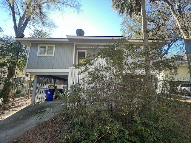 back of house with a carport