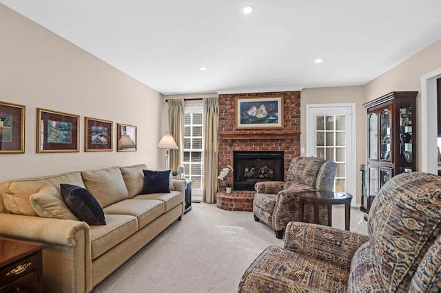 living room with light colored carpet and a brick fireplace