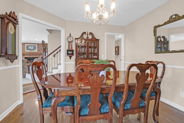 dining room featuring a notable chandelier and dark hardwood / wood-style floors