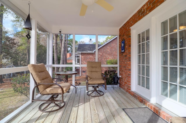 sunroom / solarium with ceiling fan