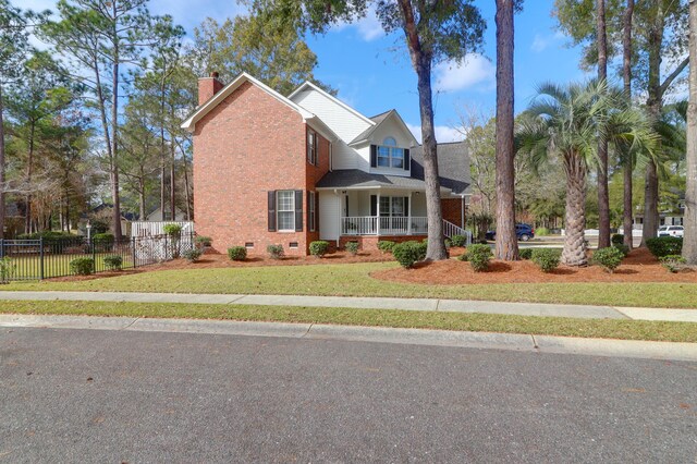 view of front of home featuring a front lawn and a porch