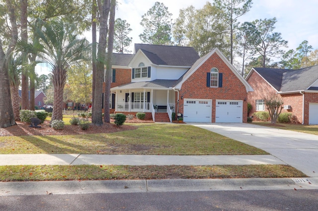 view of front of property with a garage, covered porch, and a front yard