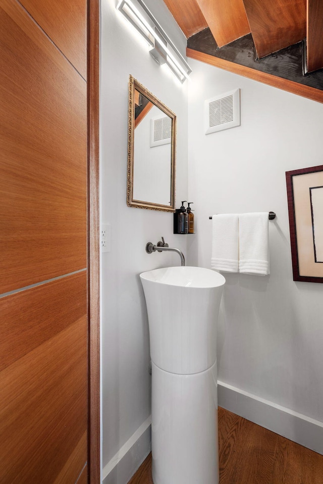 bathroom featuring wood-type flooring