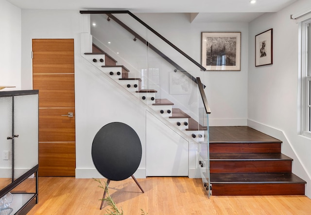 staircase featuring hardwood / wood-style flooring