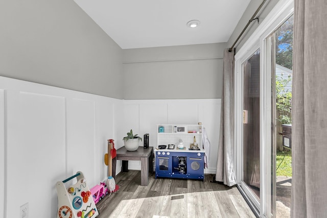 125 Towering Pine Dr, Ladson, SC 29456 - game room with wood finished floors, healthy amount of natural light, a wainscoted wall, and a decorative wall